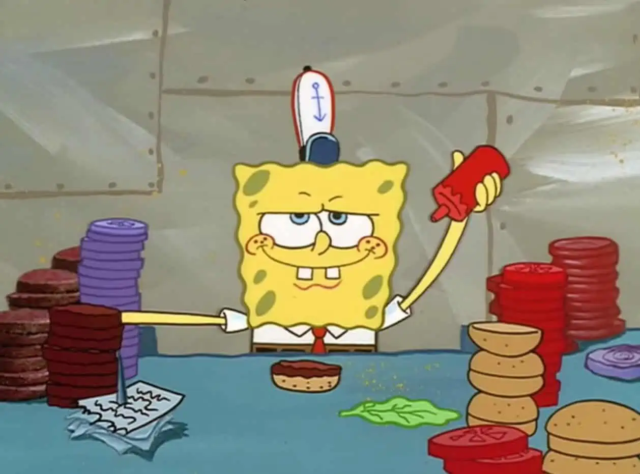 SpongeBob gleefully prepares Krabby Patties.